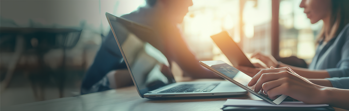 Hero image of investor working on a laptop